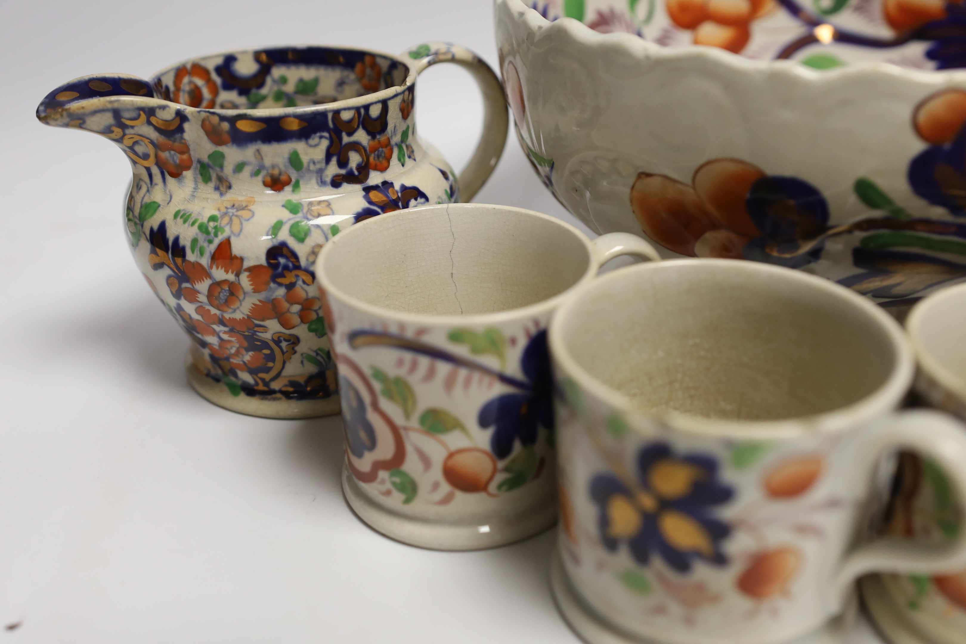 Five Welsh ‘Gaudy’ coffee cans, a large pedestal bowl and two Staffordshire jugs, bowl 21cm diameter